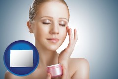 colorado a woman applying skin cream to her face