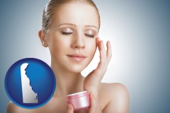 delaware map icon and a woman applying skin cream to her face