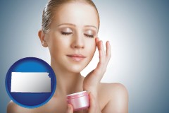 kansas map icon and a woman applying skin cream to her face