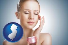 new-jersey map icon and a woman applying skin cream to her face