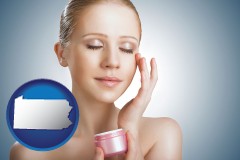 pennsylvania a woman applying skin cream to her face